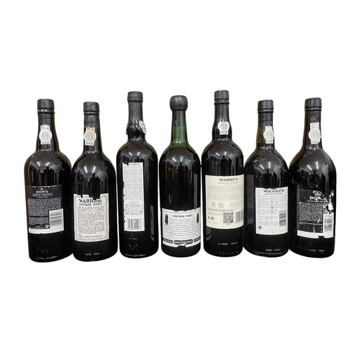 207 - An assortment of seven vintage Port bottles. The lot to include a Sandeman vintage 1970 port bottle,... 