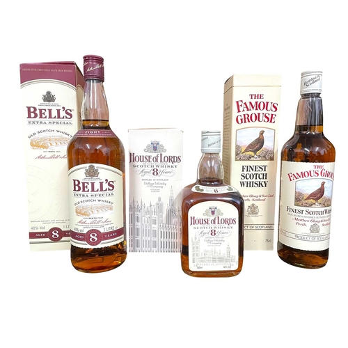 219 - Three assorted old Scotch whisky bottles. To include a House of Lords Deluxe blended Scotch whisky b... 