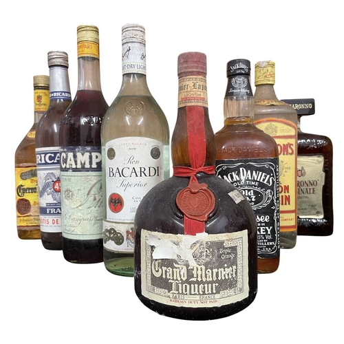 221 - A collection of eight vintage and later bottles of spirits and liqueurs. The lot to inclue a bottle ... 