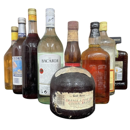 221 - A collection of eight vintage and later bottles of spirits and liqueurs. The lot to inclue a bottle ... 