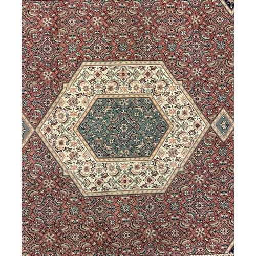 539 - A large 20th century Persian Iranian Bidjar Bijar rug carpet. The rug of symmetric design, the centr... 