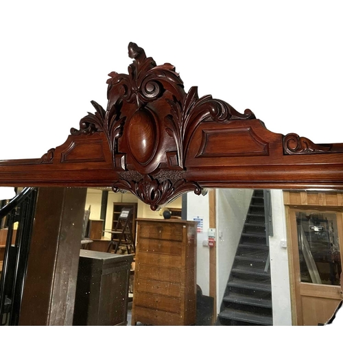 543 - A large 19th century mahogany twin pedestal mirror back sideboard. The sideboard raised on twin pede... 
