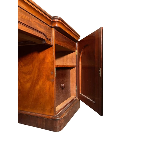 543 - A large 19th century mahogany twin pedestal mirror back sideboard. The sideboard raised on twin pede... 