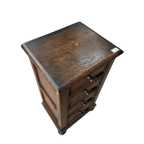 545 - A 19th century carved oak wood pedestal chest of drawers. The chest having an upright body with a ba... 
