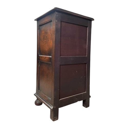545 - A 19th century carved oak wood pedestal chest of drawers. The chest having an upright body with a ba... 
