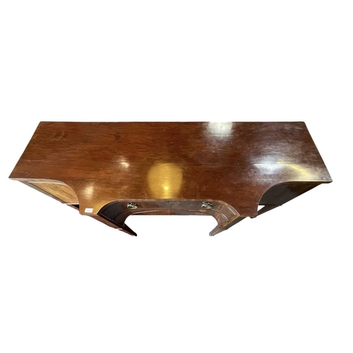 616 - A George III late 18th century mahogany sideboard credenza. The sideboard having serpentine curved f... 