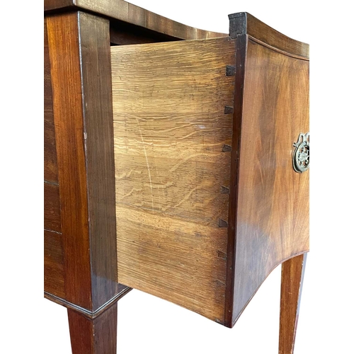 616 - A George III late 18th century mahogany sideboard credenza. The sideboard having serpentine curved f... 