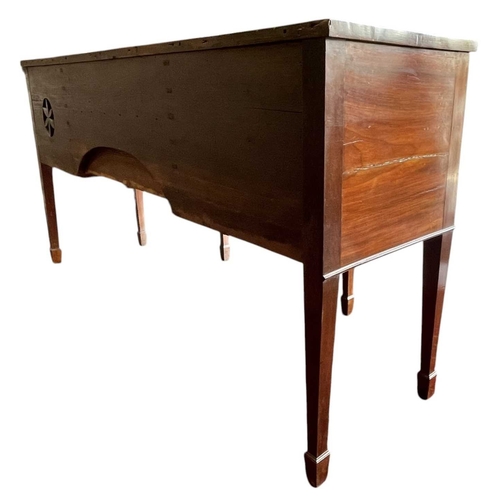 616 - A George III late 18th century mahogany sideboard credenza. The sideboard having serpentine curved f... 