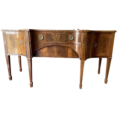 616 - A George III late 18th century mahogany sideboard credenza. The sideboard having serpentine curved f... 