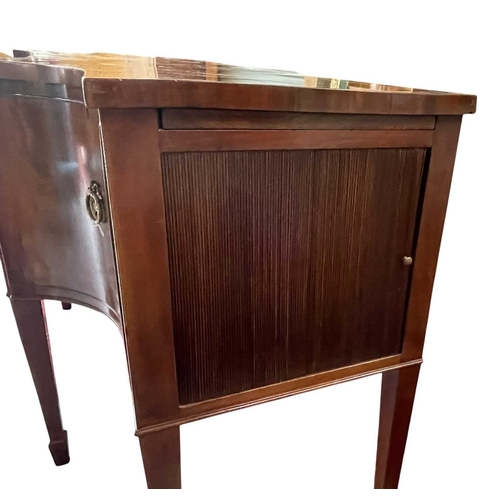 616 - A George III late 18th century mahogany sideboard credenza. The sideboard having serpentine curved f... 