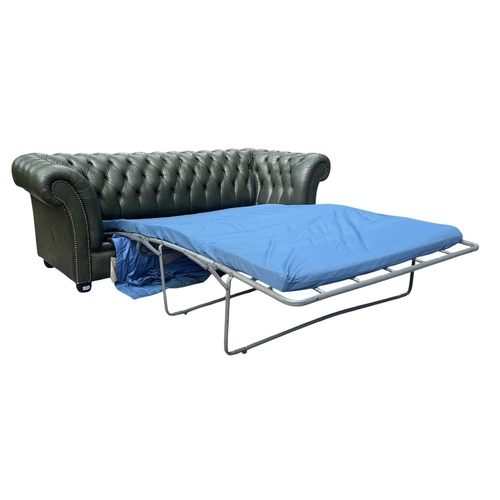623 - A Chesterfield style 20th century green leather buttoned back three seater sofa. With scrolled elbow... 