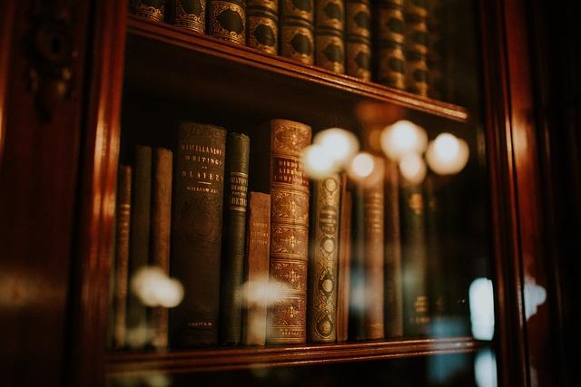 Antique books in cabinet